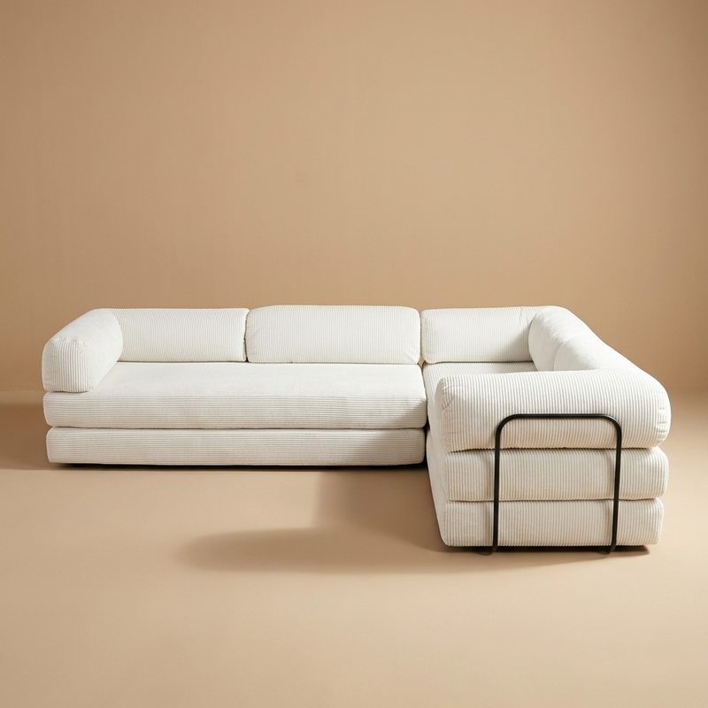 White Farmhouse style sectional sofa on a beige background