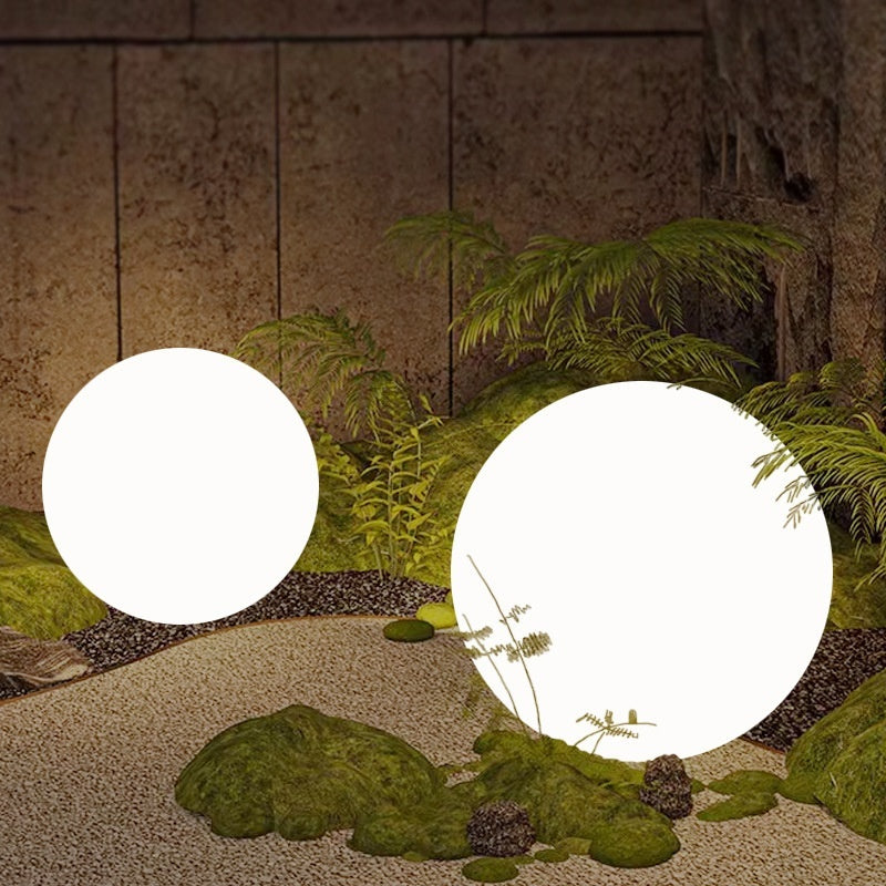 Close detail of LUNAÉ™ Glow Orb glowing amber